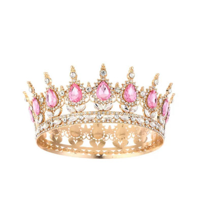 Розкішна корона-діадема із золотим оздобленням та рожевими кристалами на торт та на свято.Тренд